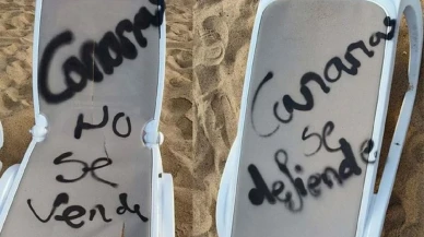 İspanya’da turizm karşıtları eylemciler şezlonga grafiti çizdi